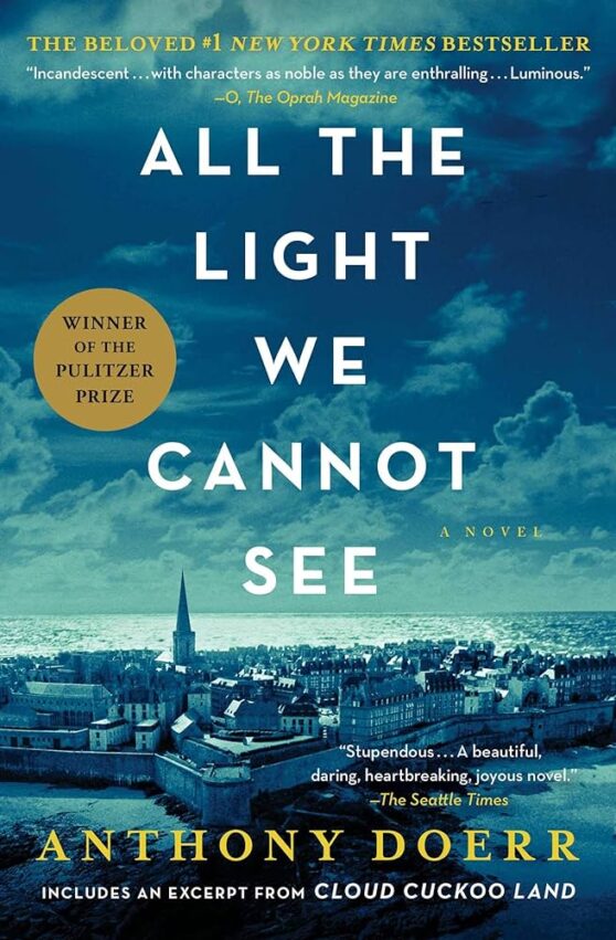 Cover of All The Light We Cannot See by Anthony Doerr. The title is in white block sans serif capitals and the authors name is in gold sans serif block capitals. There's a photo of a city with the sea in the background