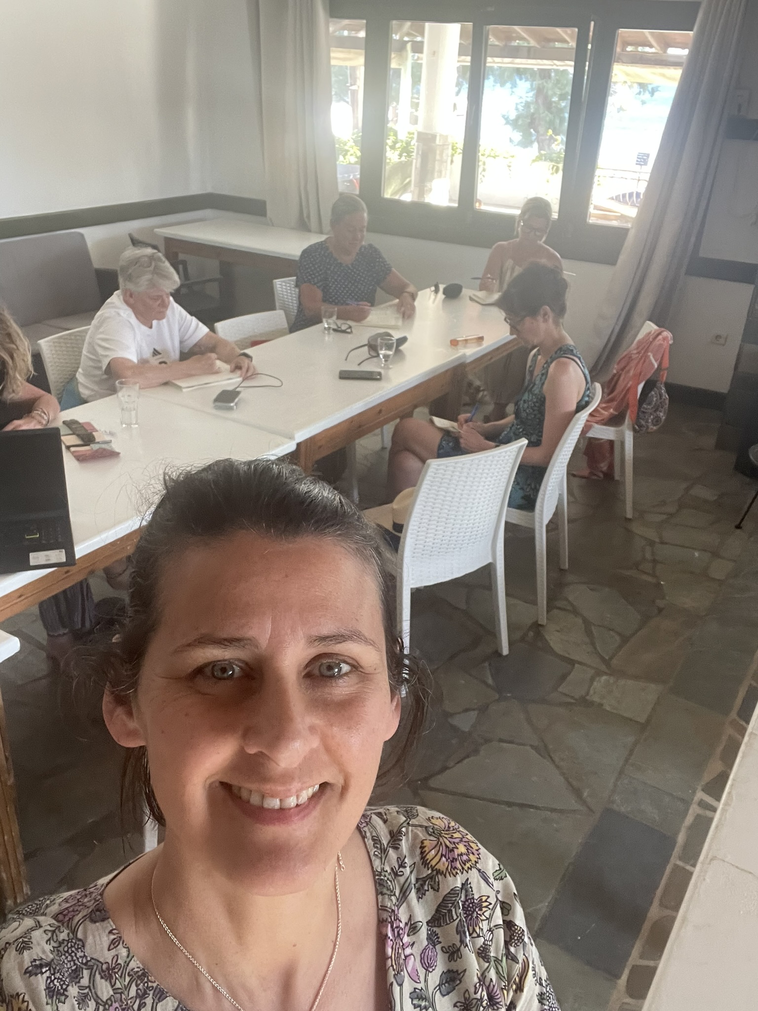 Writers at a table during a retreat session